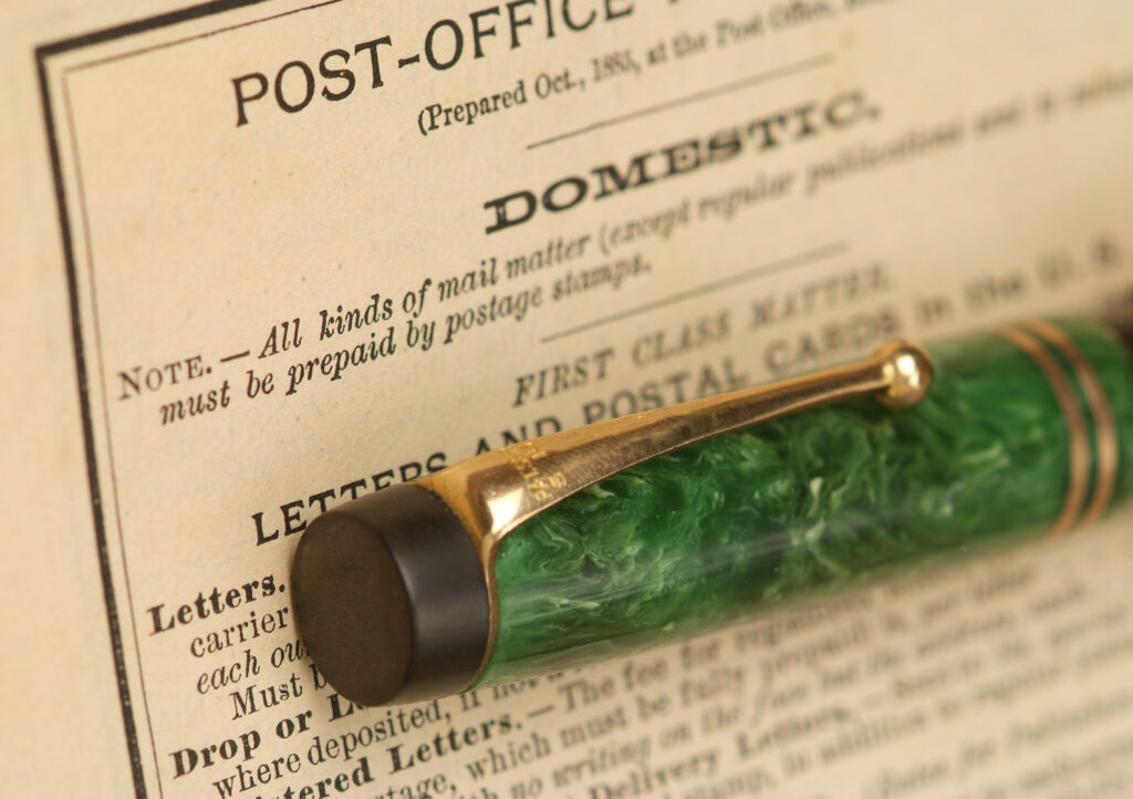 Pen on old post office rule book